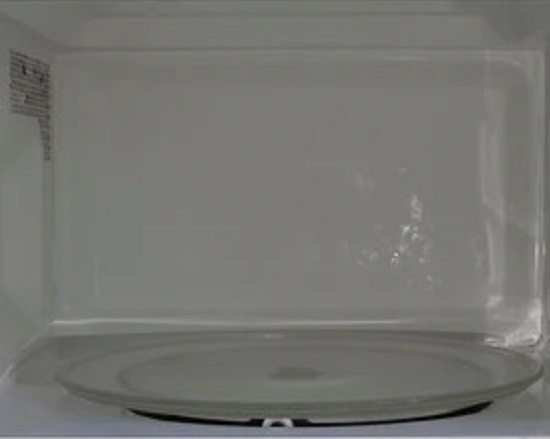 white microwave after end of lease cleaning process