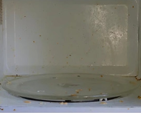 white microwave before, end of lease clean
